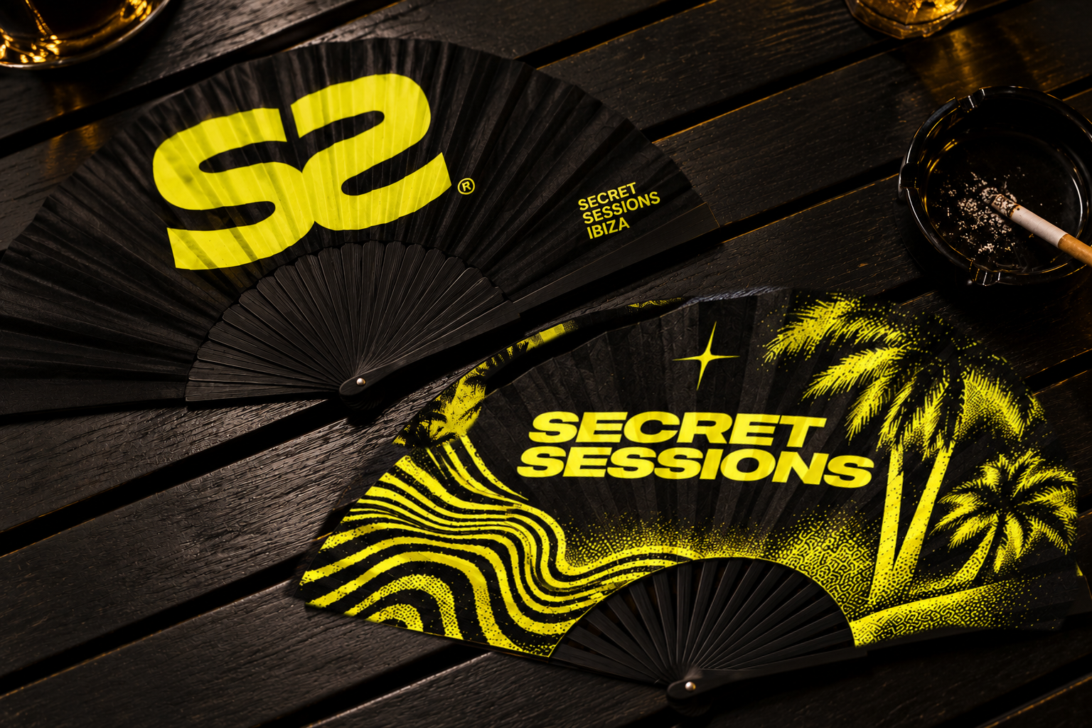 Secret Sessions Ibiza black and yellow folding fans