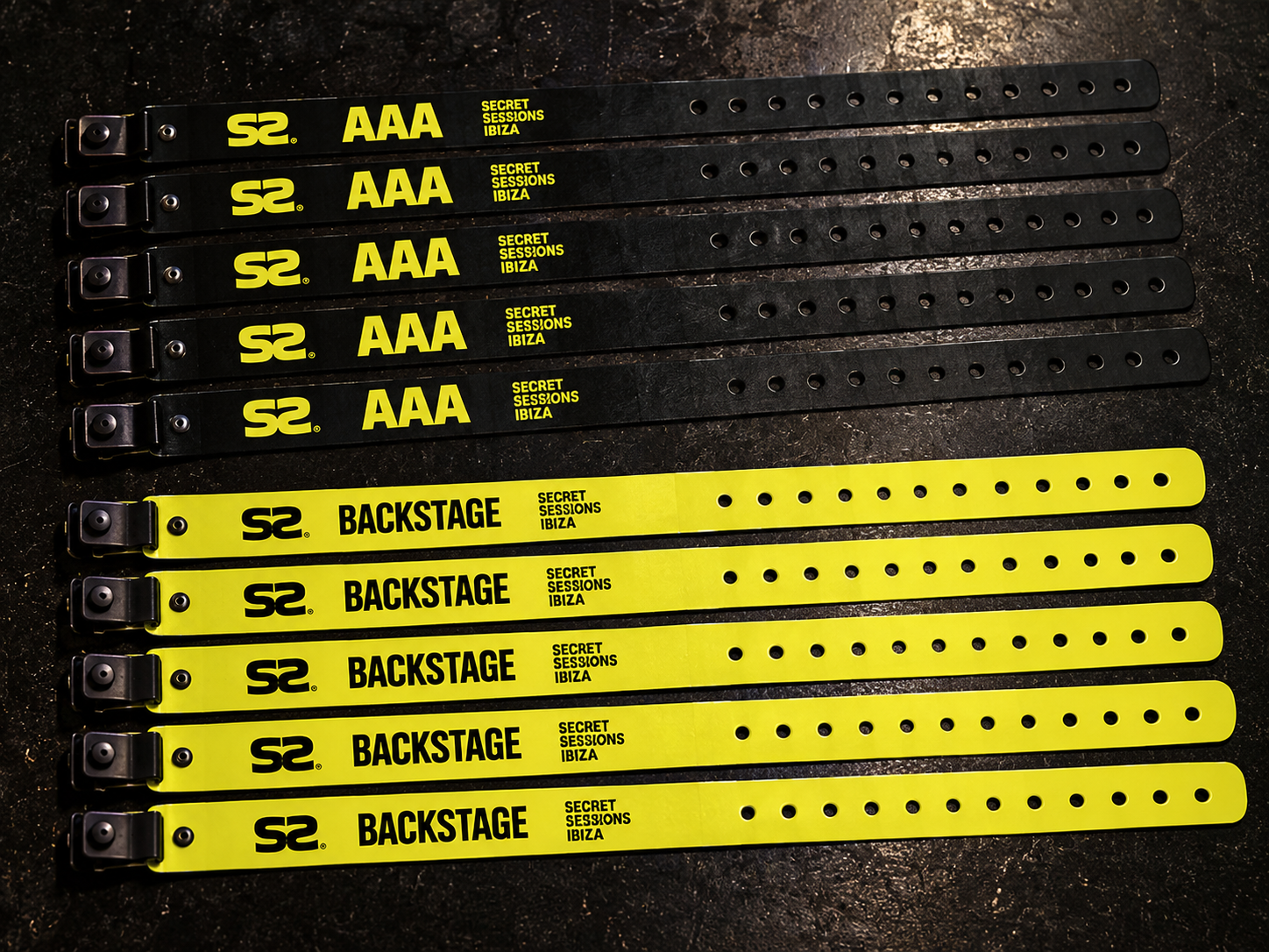 Original black AAA and yellow backstage wristbands with fastening holes